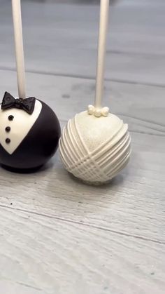 three cake pops decorated with black and white fondant