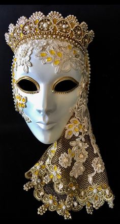 "Venetian Princess" is a beautifully decorated, exquisitely elegant in white and gold decor or masquerade mask that is a real statement piece. Embossed with gold braid, Swarovski elements, pearl beading and findings, she was the mask the artist was awarded  'Artisan of the Year" on a UK artisan group in 2018 and is a 'must have' for the serious collector of beautiful Objects D'Art.  Each Tiaura Arts piece comes with signed and dated certification detailing its unique title and catalogue number. Masquerade Mask Full Face, Venice Masquerade, Face Decor, Mask Venetian, White And Gold Decor, Theme Carnaval, Venice Carnival Costumes