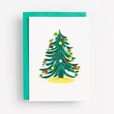 a card with a christmas tree on it