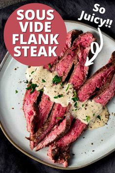 steak with sauce and parsley on top served on a white plate over a black cloth