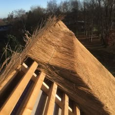 the roof of a house that has been made out of wooden slats and sticks