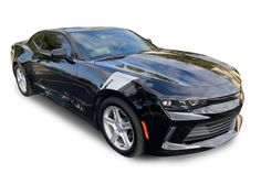 a black chevrolet camaro is shown on a white background