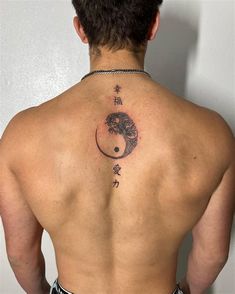 a man with a tattoo on his back is looking at the moon and tree in the sky