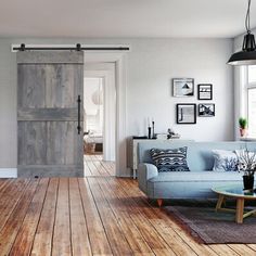 a living room filled with furniture and wooden floors