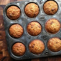 muffins in a metal pan on a wooden table