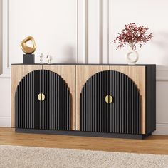 a black and wood cabinet with two doors on the front in a white living room