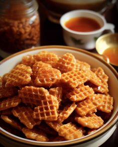 a bowl full of waffles sitting on top of a table