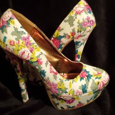 Fun Floral Round Toe Platform Pump. Never Worn. White Fabric With Pink And Green Floral Pattern.4+Inches White Fabric High Heels, White Casual Fabric Heels, Casual White Fabric Heels, Casual White Heels With Floral Print, Feminine Fitted Heels With Floral Print, White Floral Print Party Heels, Feminine Fitted Floral Print Heels, Fitted Feminine Floral Print Heels, Chic White Heels With Floral Print