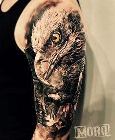 a man with an eagle tattoo on his arm