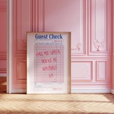 a pink room with a sign that says guest check on the wall next to it