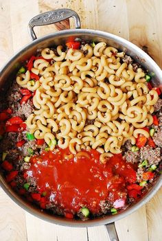 a large pot filled with pasta and meat