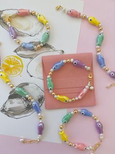 A Party on your Wrist! 7 inch Adjustable Bracelet  1 inch Extension  Gold plated beads  Ceramic Fish Charms Fresh Water Pearls Beady Eyes, Fish Bracelet, Ceramic Beads Bracelet, Ceramic Beads Necklace, Jewelry Logo Design, Fishing Bracelet, Instagram Jewelry, Jewelry Logo, Ceramic Fish