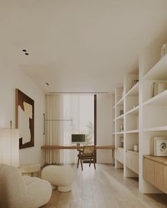 a living room filled with furniture next to a window