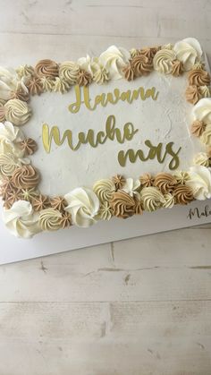 a sheet cake with white frosting and gold writing on it that says, juanna nachos mars