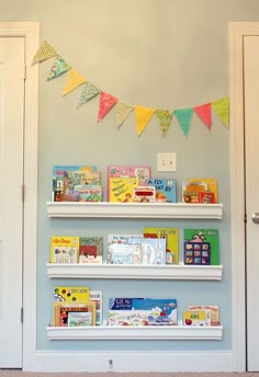 there are books on the shelves in this children's room