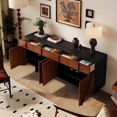 a living room filled with furniture and pictures on the wall