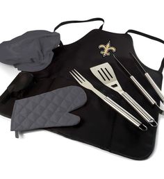 a grilling set with utensils and gloves on it