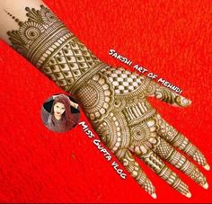 the hand is decorated with henna designs