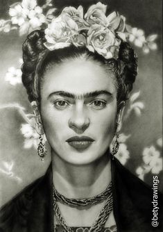 a black and white photo of a woman with flowers in her hair wearing necklaces