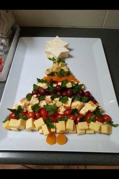 a christmas tree made out of cheese and fruit