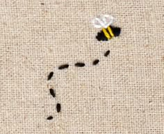 a piece of fabric with a bee on it