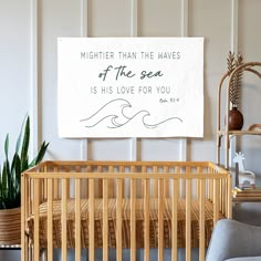 a baby's crib with a sign on the wall above it that says, mightier than the waves of the sea is his love for you