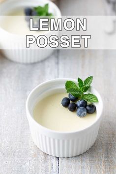 two small white bowls filled with lemon and blueberries