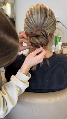 a woman getting her hair done in a salon