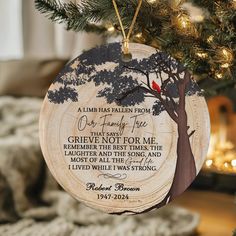 a christmas ornament hanging from a tree with a poem written on the front