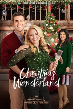 a movie poster for christmas wonderland with two people standing in front of a christmas tree