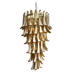 Beautiful and huge Italian Murano Chandelier composed of 83 splendid glass petals (amber with white spot) that give a very elegant look. The glasses of this chandelier are real works of art. The glasses descend with a spiral shape. Dimensions: 71,70 inches (190 cm) height with chain; 50,40 inches (120 cm) height without chain; 27,15 inches (64 cm) diameter. Dimension glasses: 11,40 inches (29 cm) height; 3,15 inches (8 cm) maximum width. Light bulbs: 7 light bulbs E14 dimension (not included in Spiral Chandelier, Murano Chandelier, Spiral Shape, Brass Frame, Chandeliers And Pendants, Amber Glass, Murano Glass, Elegant Look, Chandelier Lighting