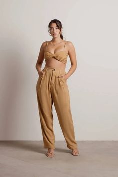 Turn heads in the Love Me Right Linen Crop Top and Pants Set in Mocha. This set features high waisted, straight leg trousers and a knotted top with a smocked back. Pair this set with white heels and a gold hoops for the perfect going out look. Crop Top And Pants Set, Crop Top And Pants, Brown Jumpsuits, Knotted Top, Linen Crop Top