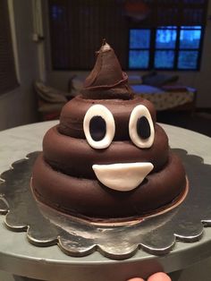 there is a chocolate cupcake with googly eyes on it