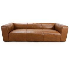 a brown leather couch sitting on top of a white floor