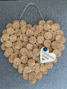 a heart made out of wine corks with a tag attached to it