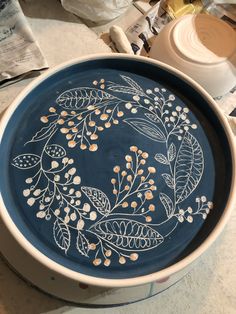 a blue bowl sitting on top of a table