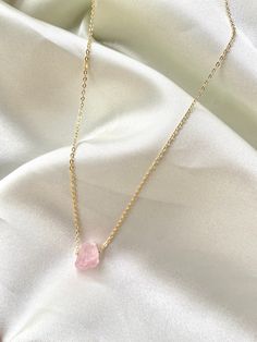 This raw rose quartz necklace is made with 14k plated gold chain and is perfect for crystal lovers looking for love, calmness/peace, inner healing or trust. It is dainty, durable and perfect as an everyday jewelry piece or as a gift. 14k gold rose quartz necklace / raw rose quartz necklace / crystal necklace / rose quartz pendant / chakra / crystal jewelry / canada Materials: Raw Rose Quartz (10mm-15mm) 14k Plated chains, loops, and lobster claw  Necklace care: -Avoid Tugging on the chain or cry Crystal Necklace Rose, Raw Rose Quartz Necklace, Claw Necklace, Rose Gold Quartz, Raw Rose Quartz, Rose Quartz Pendant, Rose Quartz Necklace, Necklace Rose, Necklace Crystal