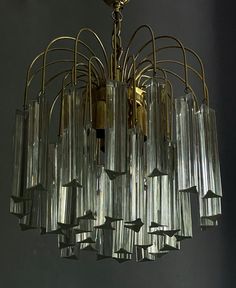 a chandelier with many glass tubes hanging from it