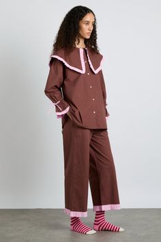 Our Barbara pyjama set features an oversized collar, for those who like to keep their looks that little bit extra, even when while they're asleep. • Top and bottoms • Matching bag included • Oversized collar • Button fastening at back • Button-down front • Cropped sleeve • Elasticated waist with functional tie • 100% organic cotton • Designed in London MODEL INFO: Model is 5'10 and is wearing a UK 8. Damson Madder, London Models, Oversized Collar, Checked Scarf, Hooded Scarf, Striped Scarves, Pink Gingham, Pyjama Set, Pj Sets