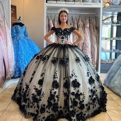 This exquisite Ball Gown 15 Black Quinceanera Dress will make an unforgettable statement at any occasion. Intricate 3D flowers and shimmering crystals add texture and elegance to the look. Perfect for a quinceanera or birthday celebration, this gown will take the spotlight. Catalogue: black 2024 Quinceanera DressesVenu Dresses With 3d Flowers, Lavender Prom Dress Long, Black Quinceanera, Lavender Prom Dresses, Black Quinceanera Dresses, Halter Evening Dress, Quinceanera Themes, Quince Dress, Wedding Veils Lace