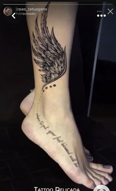 a woman's foot with an angel wing tattoo on the side of her leg