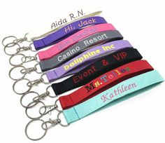 six lanyards with name tags on them are shown in different colors and sizes