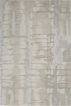 an area rug that has been made with different colors and patterns on the fabric, including beige