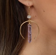 "A glowing crystal point in your choice of rose quartz, smoky quartz, amethyst or crystal quartz is wire wrapped by hand and dangles from the middle of a delicate and lightweight metal hoop. Hoop and crystal dangle from a sparkling Herkimer diamond. Earrings hang about 2.5 inches, including earring hook. *You get to choose sterling silver, 14k rose gold filled or 14k gold filled wire and components* \"Gold Filled\": a thick layer of solid gold which is bonded to a base metal. Gold filled jewelry Drop Crystal Earrings, Moon Wire Earrings, Wire Wrap Hoop Earrings, Crystal Wire Earrings, Wire Wrapped Hoop Earrings, Quartz Jewelry Diy, Crystal Earrings Aesthetic, Wire Crystal Jewelry, Diy Metal Earrings