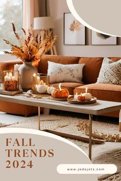 a living room filled with lots of furniture and candles on top of a coffee table