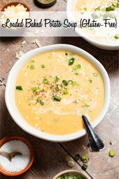 two bowls filled with soup on top of a wooden table