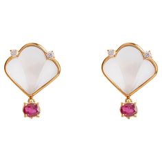 Rossella Ugolini Deco Collection, Deco Style 18 Karats Yellow Gold Oval Cut 1,60 Carats Rubies, Rock Crystal 0.12 Carats White Diamonds Stud Earrings. Classy and elegant Stud Earrings Handcrafted with a frosted fan shape Rock Crystal on lobo set on a bezel made in 18 karats Yellow Gold and two White Diamonds. This part could be adapted for a clip-on earrings. Fan shape suspends an oval cut 1,60 Carats Red Ruby. Deco-inspired takes on the style—with a touch colorful options for the truly elegant Crystal Stud Earrings, Oval Cut Diamond, Red Ruby, Rock Crystal, White Diamonds, Deco Style, Diamond Earrings Studs, San Valentino, Diamond Studs