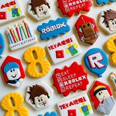 decorated cookies are displayed on a table for children's birthdays and special occasiones