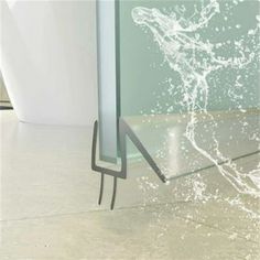 water splashing on the floor in front of a mirror