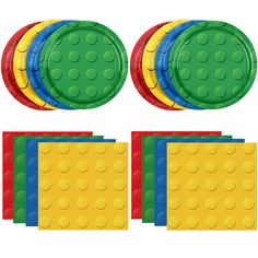 a set of four lego coasters, each with different colored circles on the top